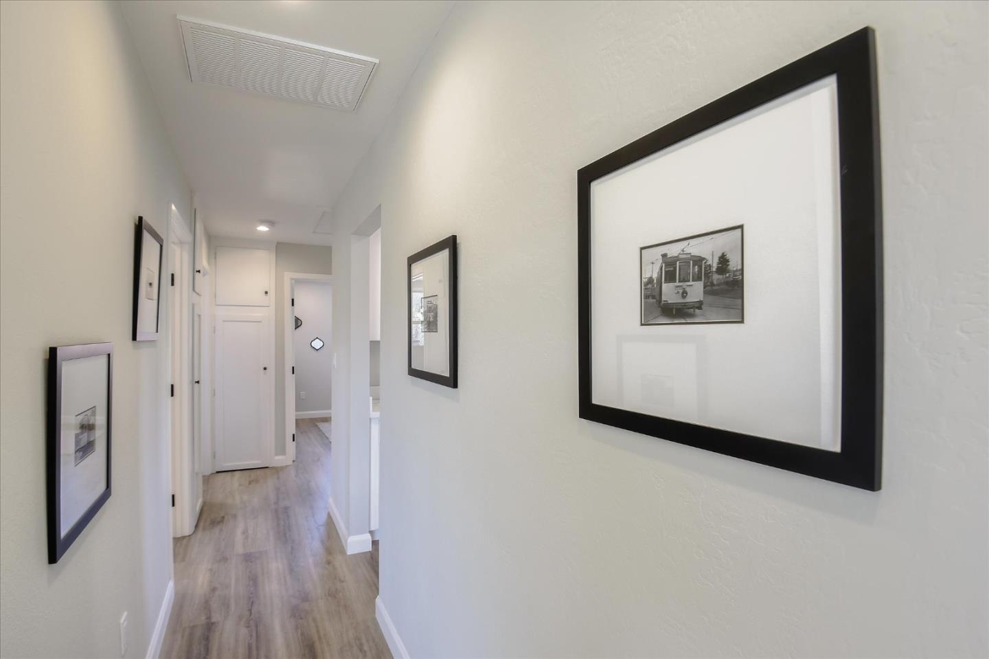 504 Arguello Boulevard Pacifica, CA 94044 - Photo 25 of 42 a view of a hallway with wooden floor