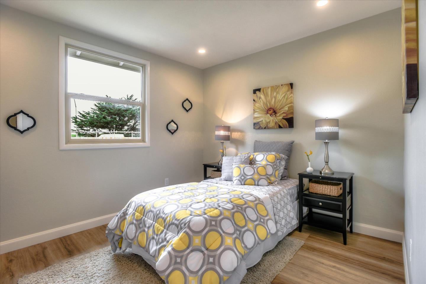 504 Arguello Boulevard Pacifica, CA 94044 - Photo 29 of 42 a bedroom with a bed and a window