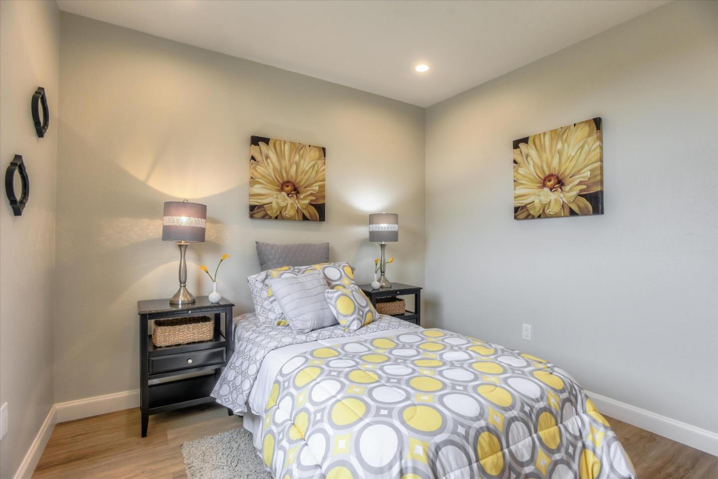 504 Arguello Boulevard Pacifica, CA 94044 - Photo 30 of 42 a bedroom with a bed and a lamp