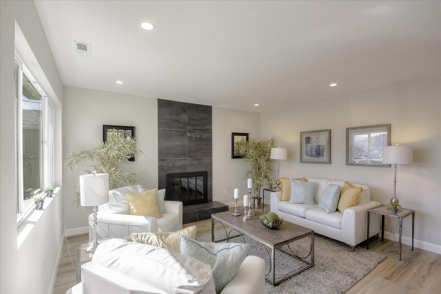 504 Arguello Boulevard Pacifica, CA 94044 - Photo 3 of 42 a living room with furniture and a fireplace