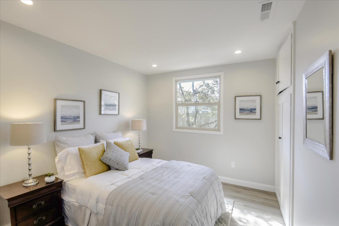 504 Arguello Boulevard Pacifica, CA 94044 - Photo 33 of 42 a bedroom with a bed and a window