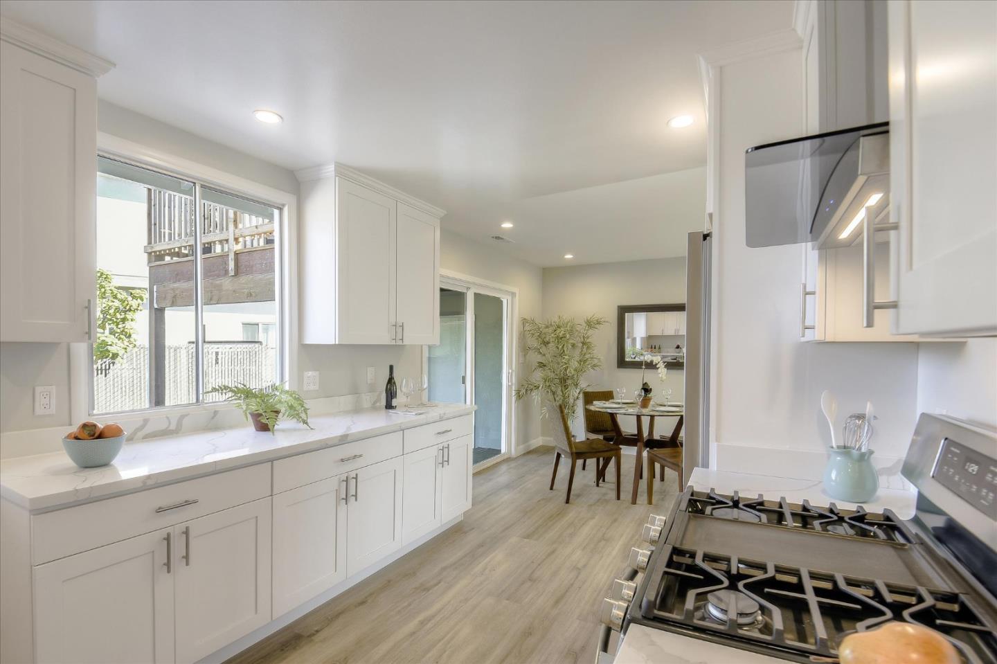 504 Arguello Boulevard Pacifica, CA 94044 - Photo 10 of 42 a large white kitchen with a large window