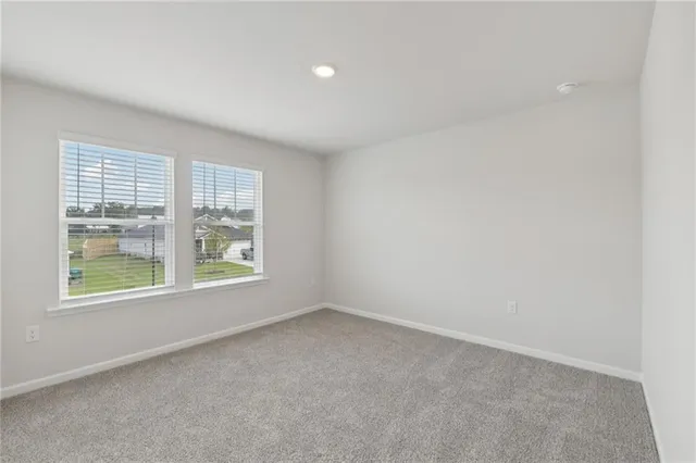 a view of an empty room and a window