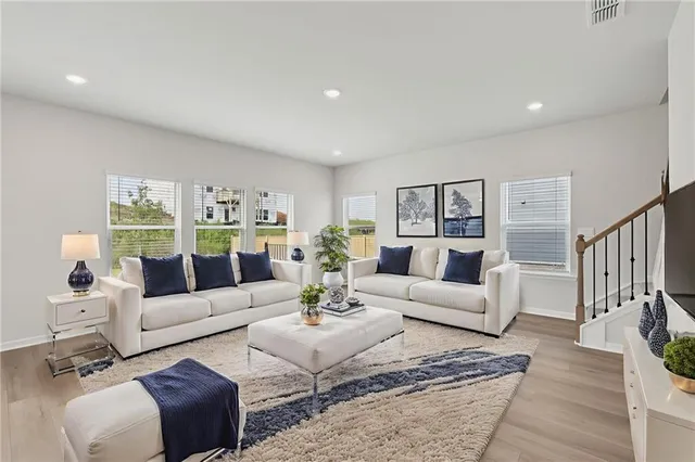 a living room with furniture or couch and a wooden floor