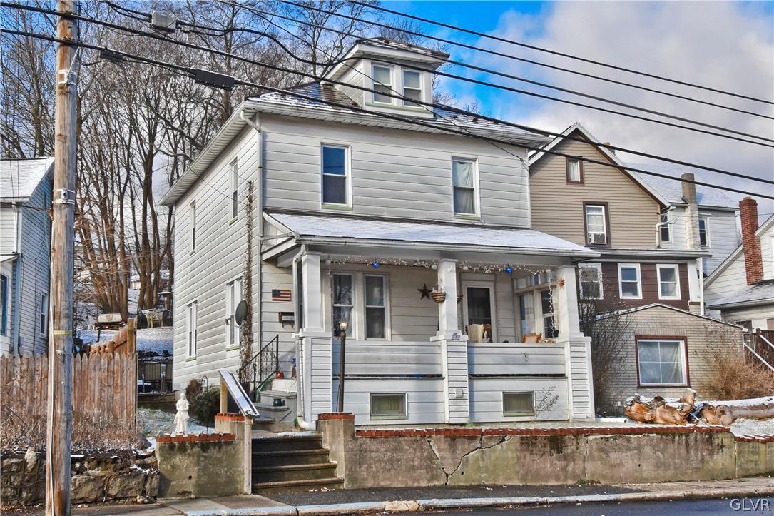 a view of a white building among the street