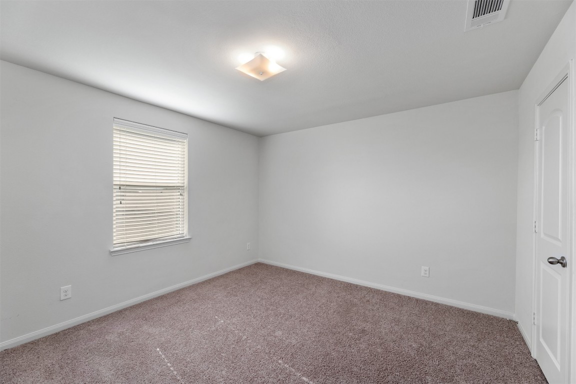 9715 Blue Sapphire Lane Rosharon, TX 77583 - Photo 16 of 30 Secondary bedrooms with recent carpet and located on the second floor.