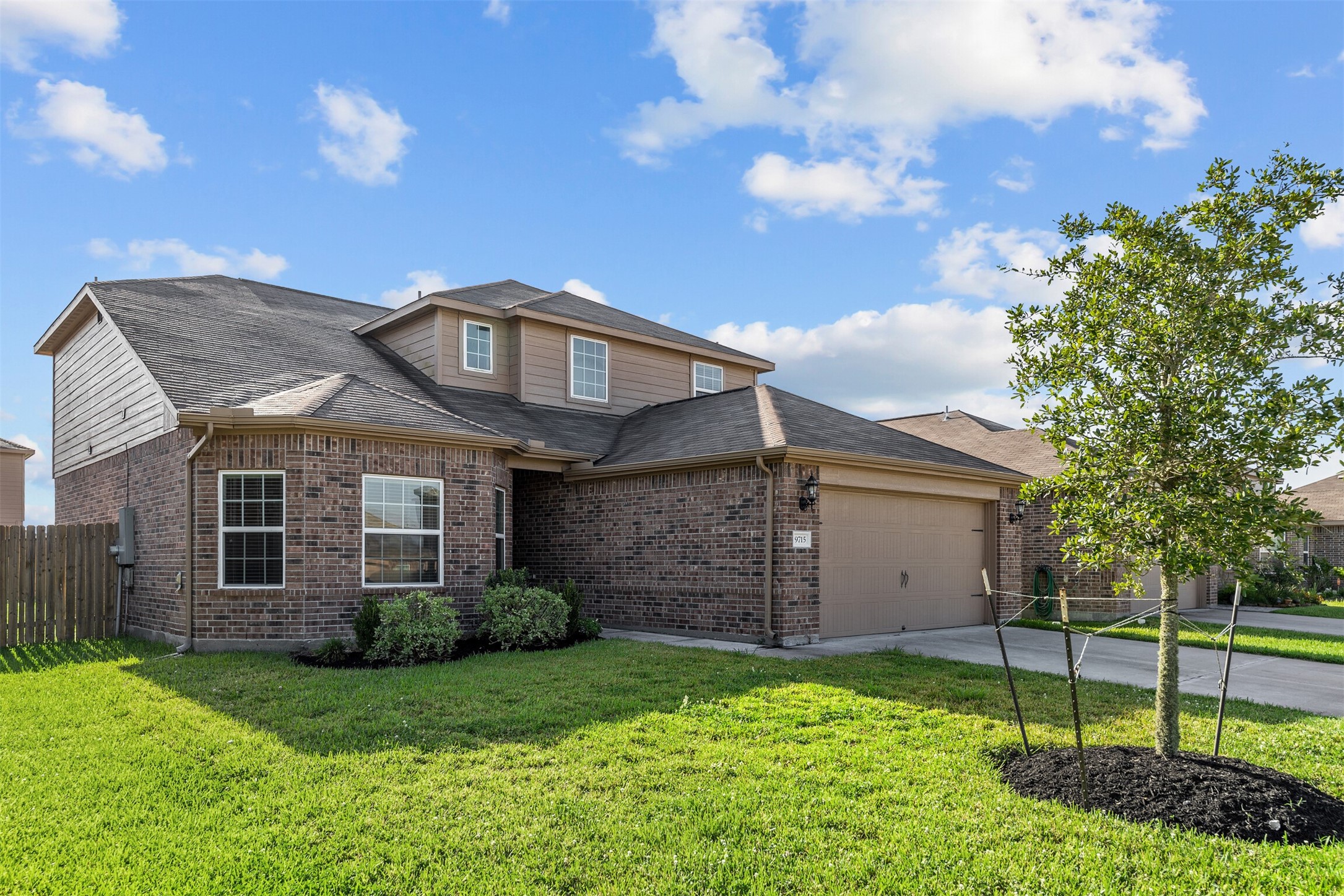 9715 Blue Sapphire Lane Rosharon, TX 77583 - Photo 3 of 30 Great curb curb appeal with freshly placed black mulch and well maintained brick exterior.