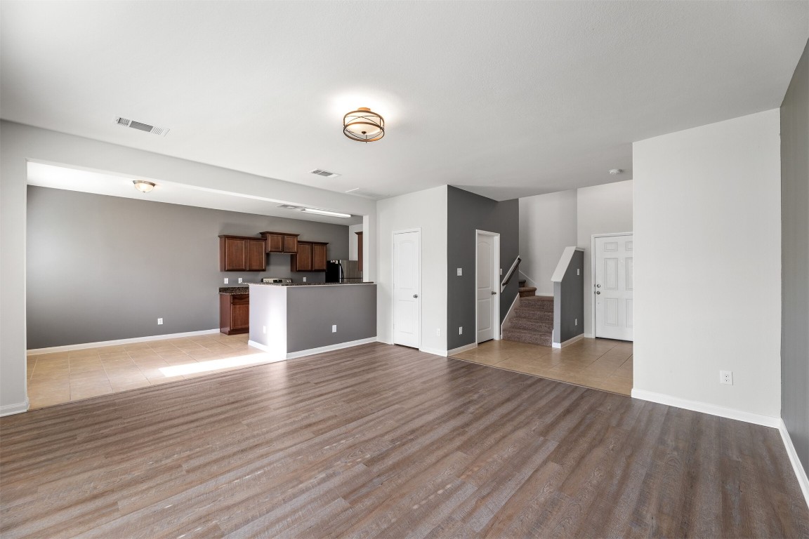 9715 Blue Sapphire Lane Rosharon, TX 77583 - Photo 6 of 30 Spacious living room with vinyl flooring and separate dining room.