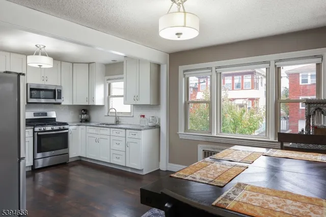 a kitchen with a stove and a window