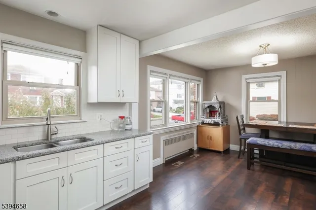 a open kitchen with sink and window