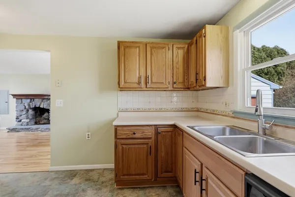 a kitchen with a sink and cabinets
