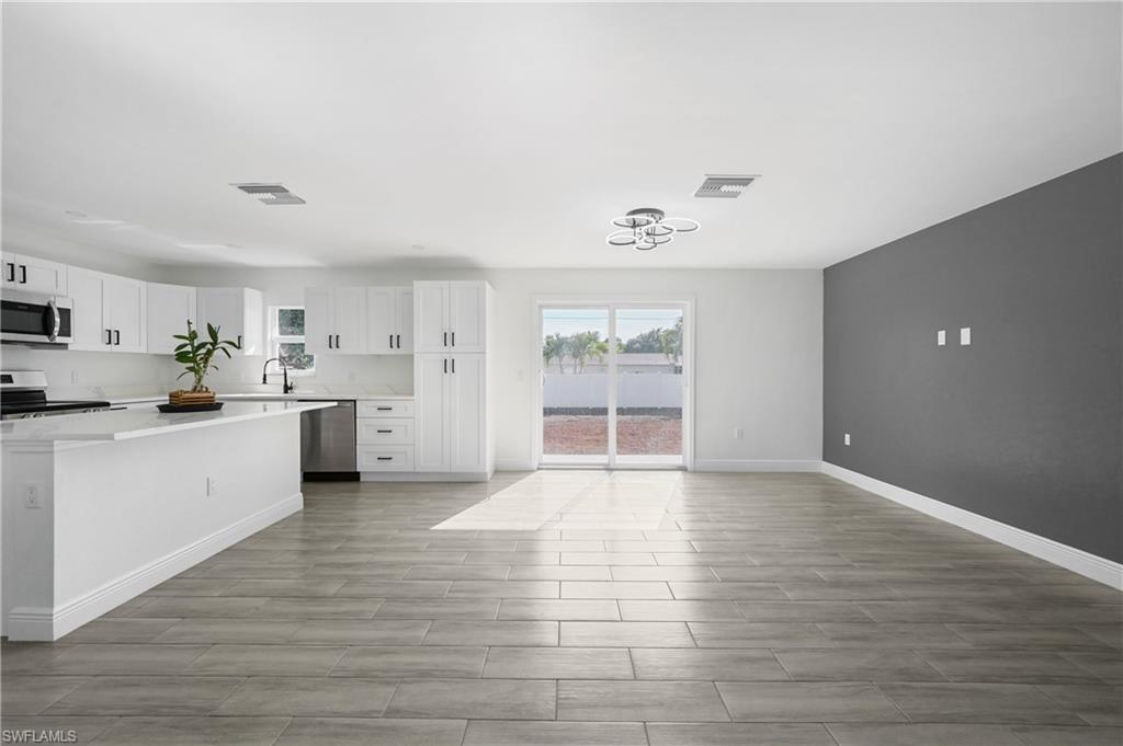 4448 18th Avenue Southwest Naples, FL 34116 - Photo 16 of 40 a view of an empty room with a window