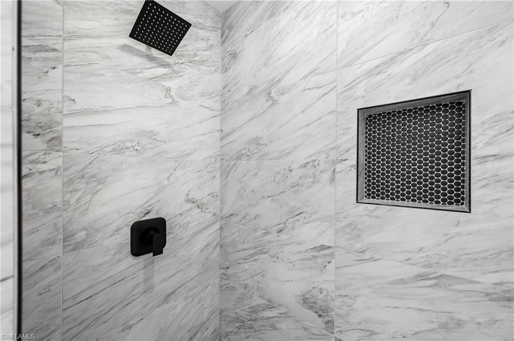4448 18th Avenue Southwest Naples, FL 34116 - Photo 20 of 40 Bathroom view of a marbleish finish shower