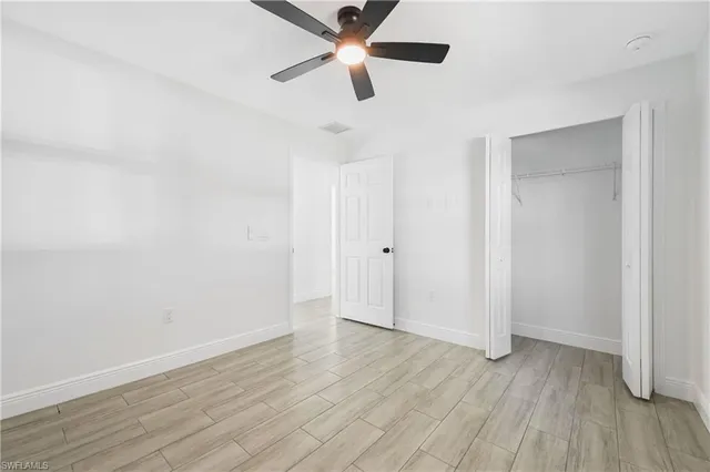 a bathroom with a sink vanity mirror and toilet