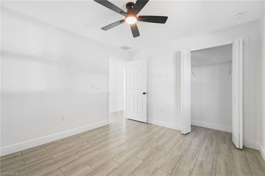 4448 18th Avenue Southwest Naples, FL 34116 - Photo 23 of 40 a view of empty room with wooden floor
