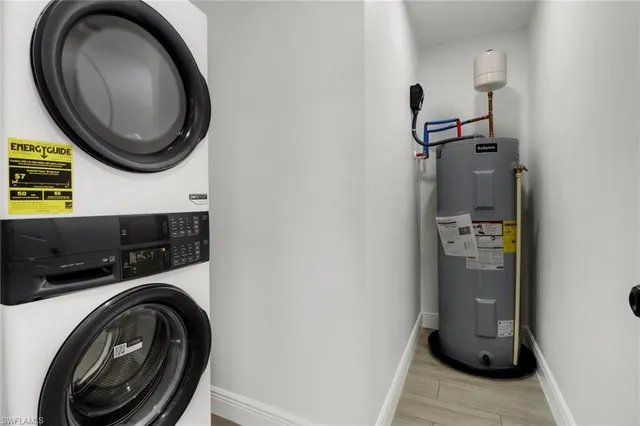 a bathroom with a sink and a washer dryer