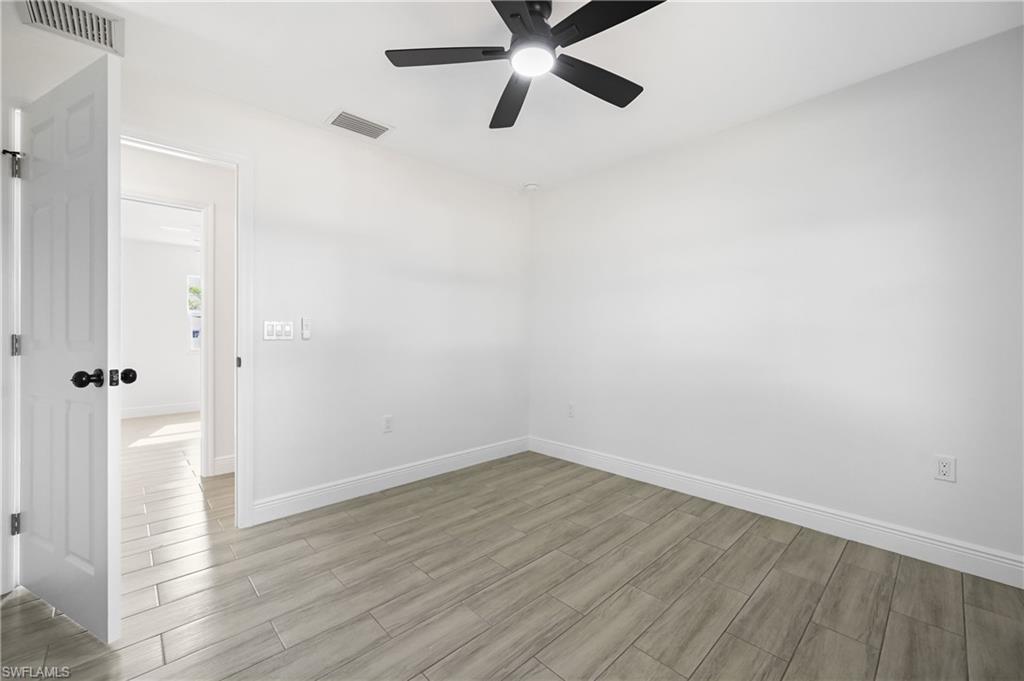 4448 18th Avenue Southwest Naples, FL 34116 - Photo 28 of 40 wooden floor in an empty room