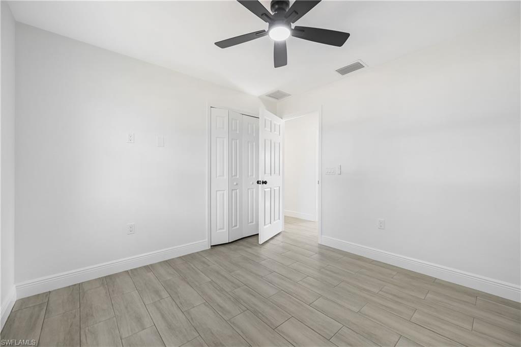4448 18th Avenue Southwest Naples, FL 34116 - Photo 29 of 40 wooden floor in an empty room