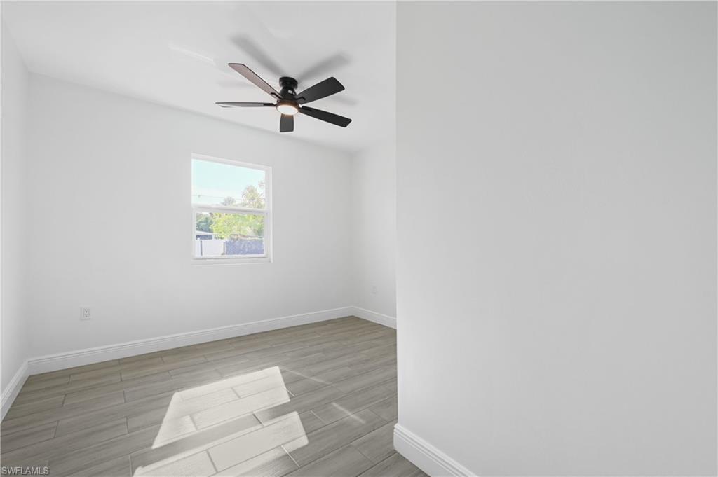 4448 18th Avenue Southwest Naples, FL 34116 - Photo 30 of 40 a view of room with window and ceiling fan