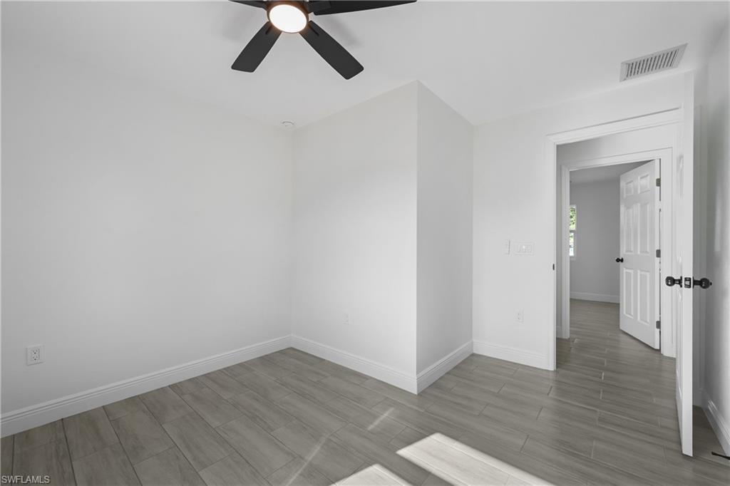4448 18th Avenue Southwest Naples, FL 34116 - Photo 31 of 40 a view of empty room with wooden floor