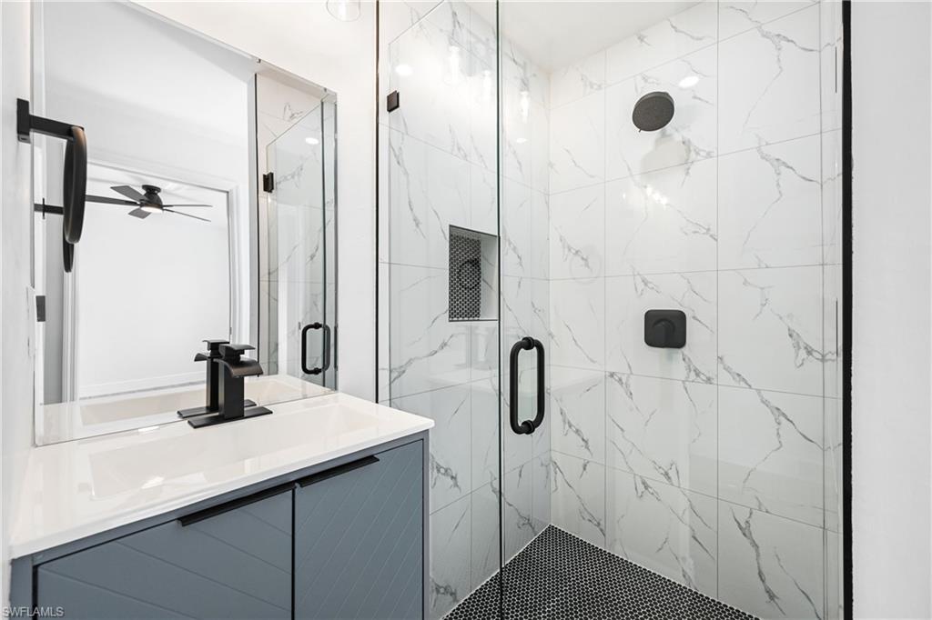 4448 18th Avenue Southwest Naples, FL 34116 - Photo 34 of 40 a bathroom with a sink and a mirror