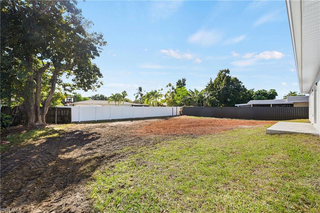 4448 18th Avenue Southwest Naples, FL 34116 - Photo 38 of 40 Fenced backyard with a patio area