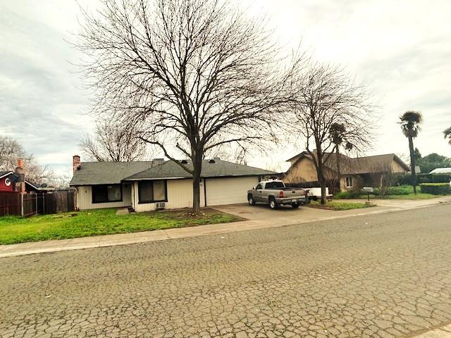 8422 Ancho Way Elverta, CA 95626 - Photo 2 of 8 a front view of a house with a yard and garage