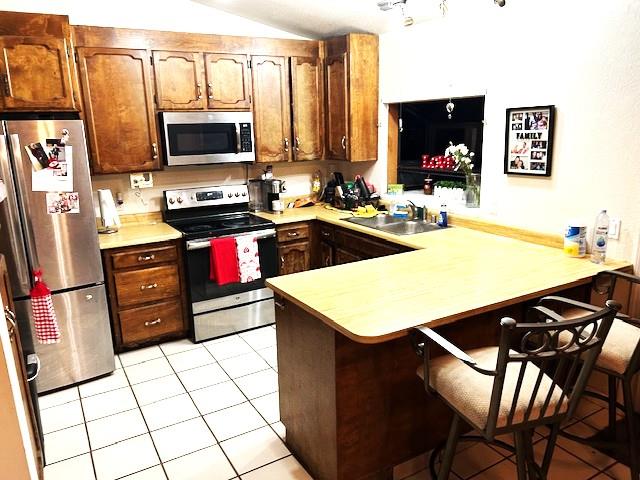 8422 Ancho Way Elverta, CA 95626 - Photo 4 of 8 a kitchen with stainless steel appliances a stove a sink and a refrigerator