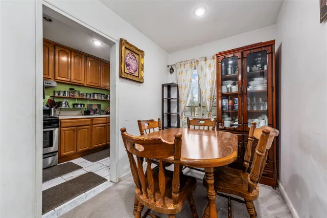 a dining room with furniture and chandelier