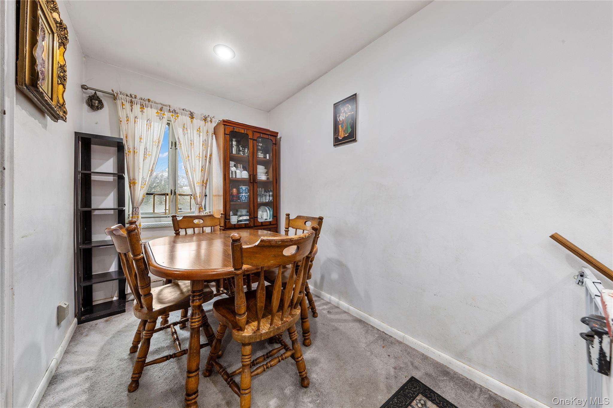 221-15 Manor Road, Unit UPPR Queens, NY 11427 - Photo 14 of 16 a view of a dining room with furniture