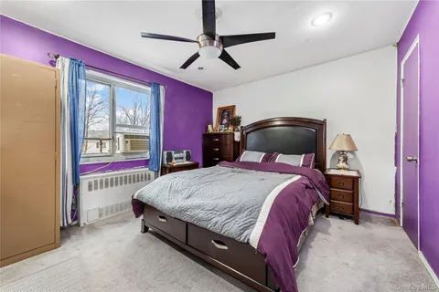 a bed room with a bed and a chandelier