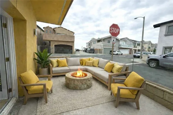 a living room with furniture a fireplace and a table