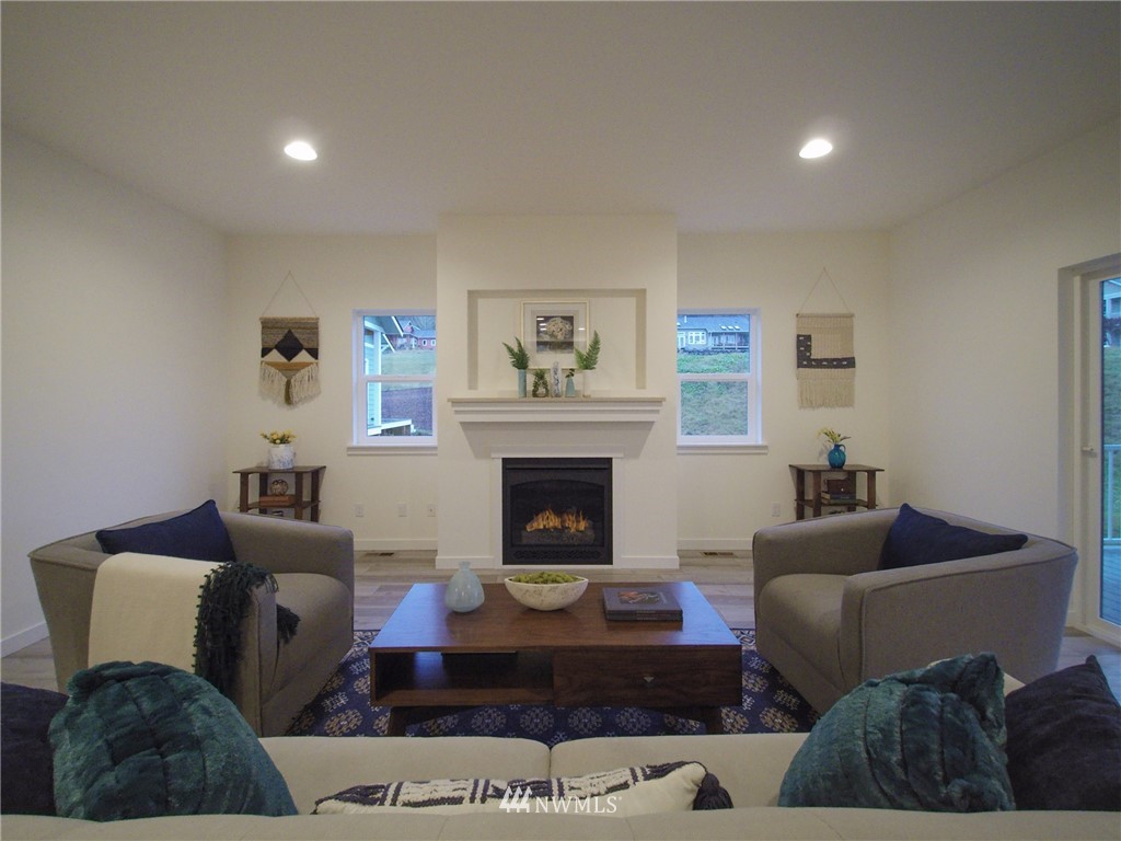 21 Snowbell Court Sequim, WA 98382 - Photo 3 of 36 a living room with furniture and a fireplace