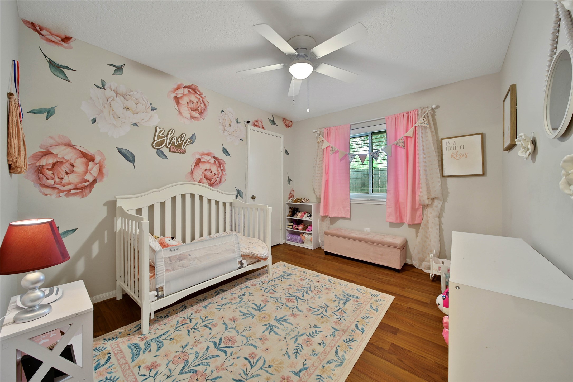 4843 Drew Forest Lane Humble, TX 77346 - Photo 30 of 37 Bedroom #3 is another good size. The beautiful flower decals are stickers and can stay or can easily be peeled off!