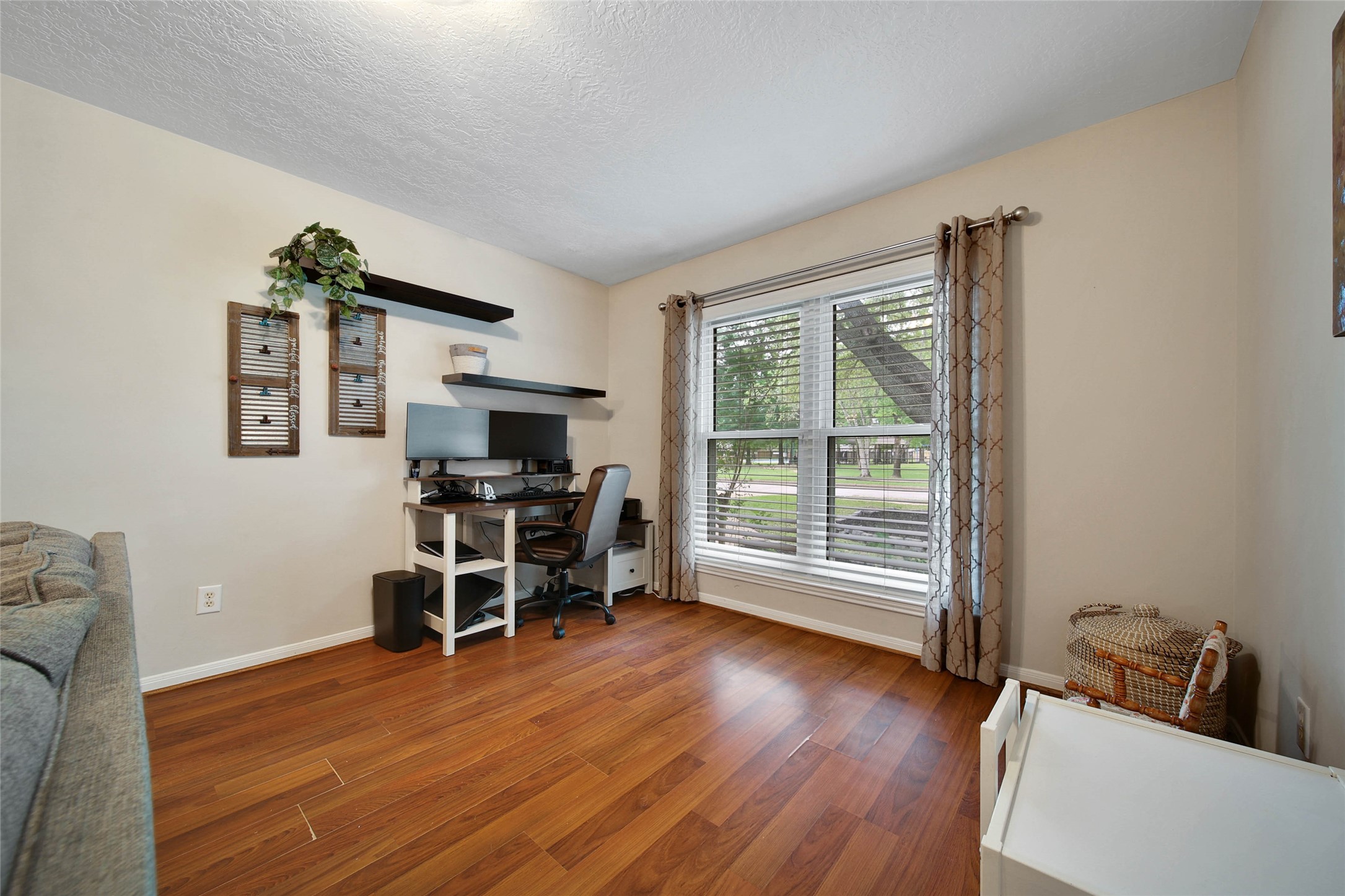 4843 Drew Forest Lane Humble, TX 77346 - Photo 9 of 37 This front living/office space over looks the front yard. You can also see the community playground and pool that are just across the street!