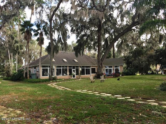 108 River's Edge Road North St. Augustine, FL 32092 - Photo 4 of 4 a front view of a house with a garden