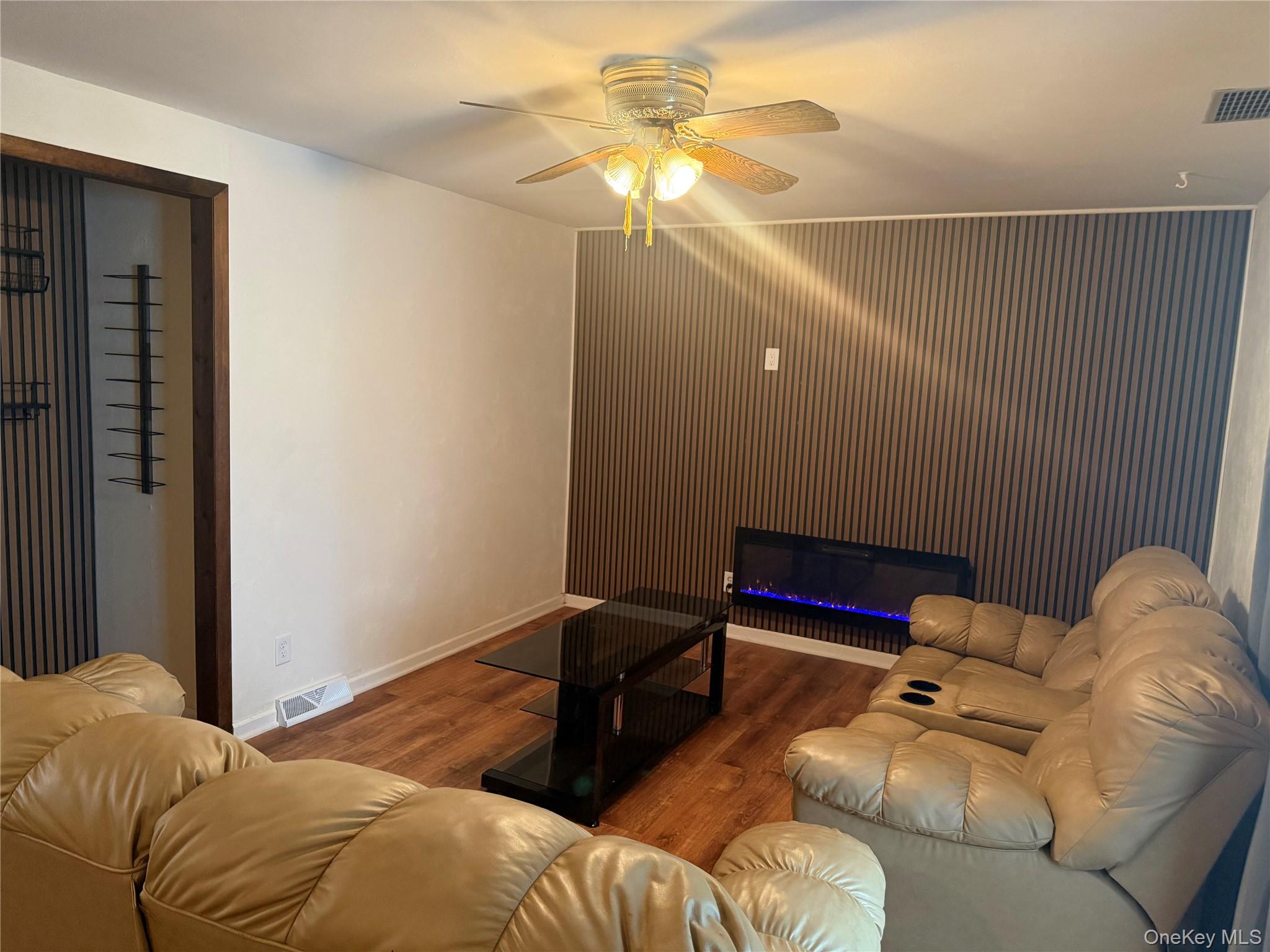 Undisclosed Address Poughkeepsie, NY 12603 - Photo 2 of 7 a living room with furniture and a ceiling fan