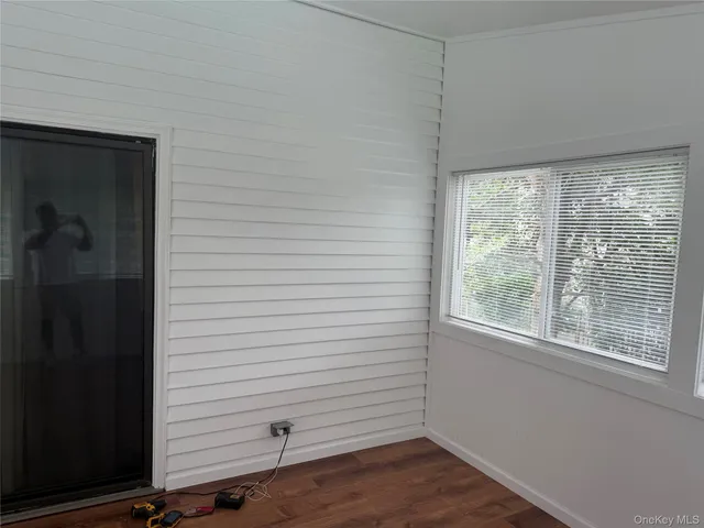 a view of a room that has a window in it