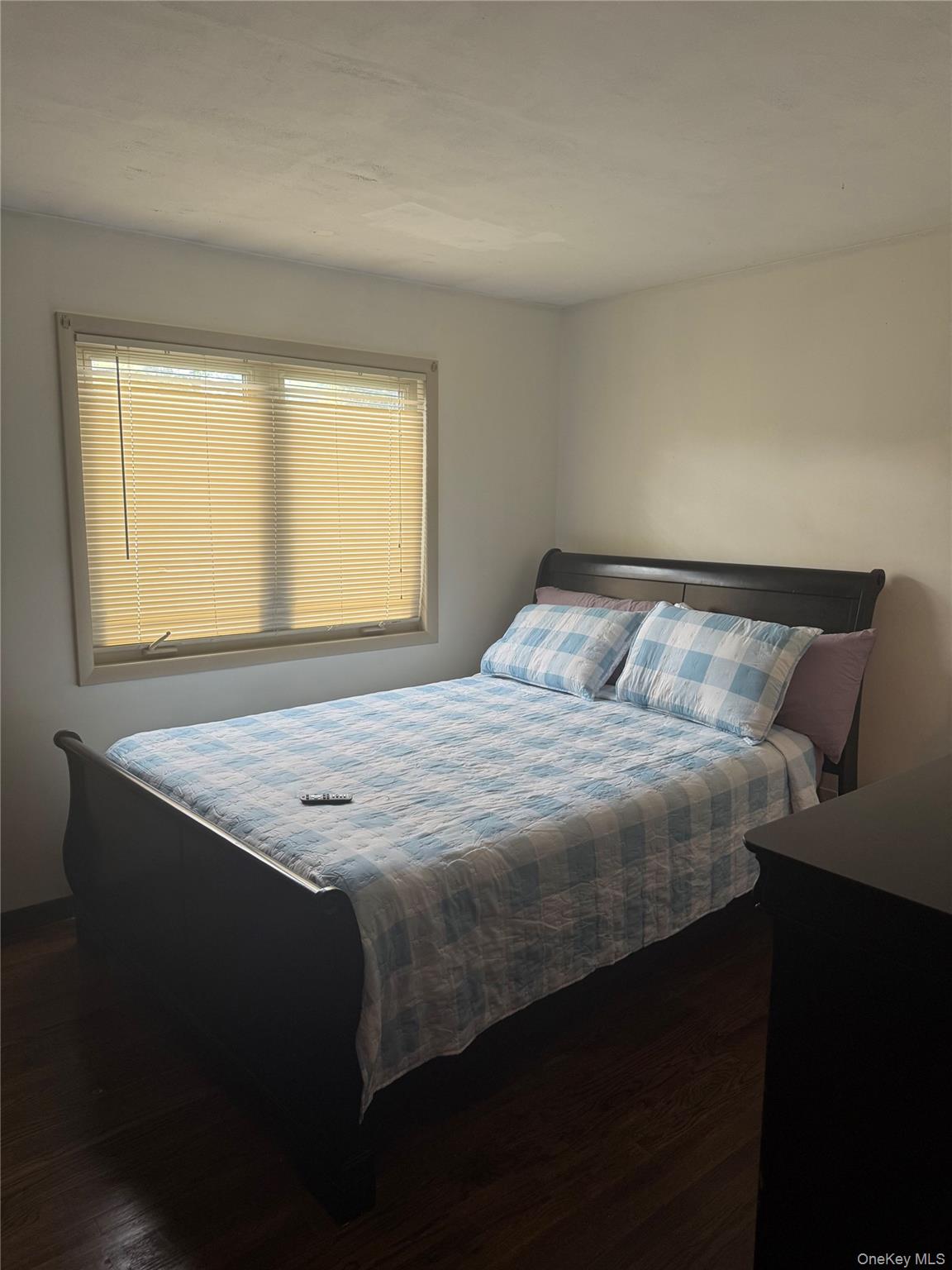 Undisclosed Address Poughkeepsie, NY 12603 - Photo 6 of 7 a bedroom with a bed and window