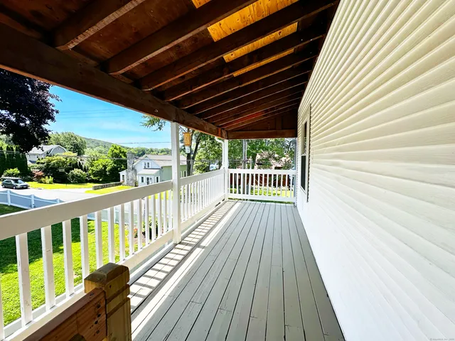 a view of balcony with wooden floor