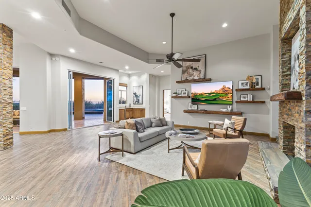 a living room with furniture and a large window