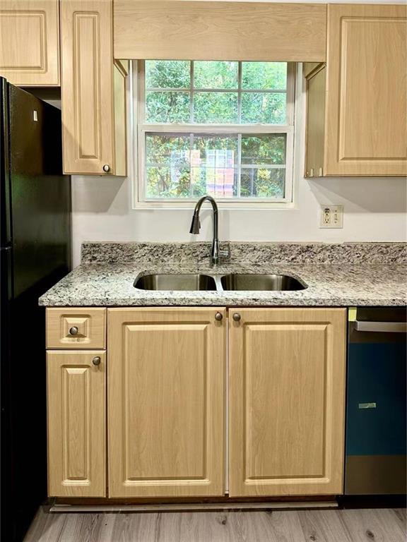 3665 Chestnut Drive, Unit F2 Atlanta, GA 30340 - Photo 19 of 21 a bathroom with granite countertop a sink and a window