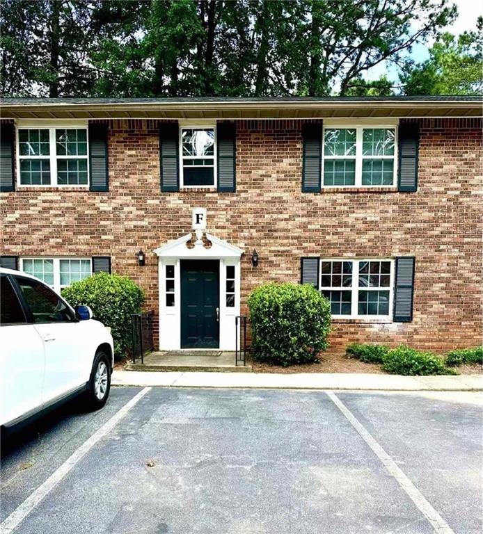 3665 Chestnut Drive, Unit F2 Atlanta, GA 30340 - Photo 3 of 21 a view of a house with a yard