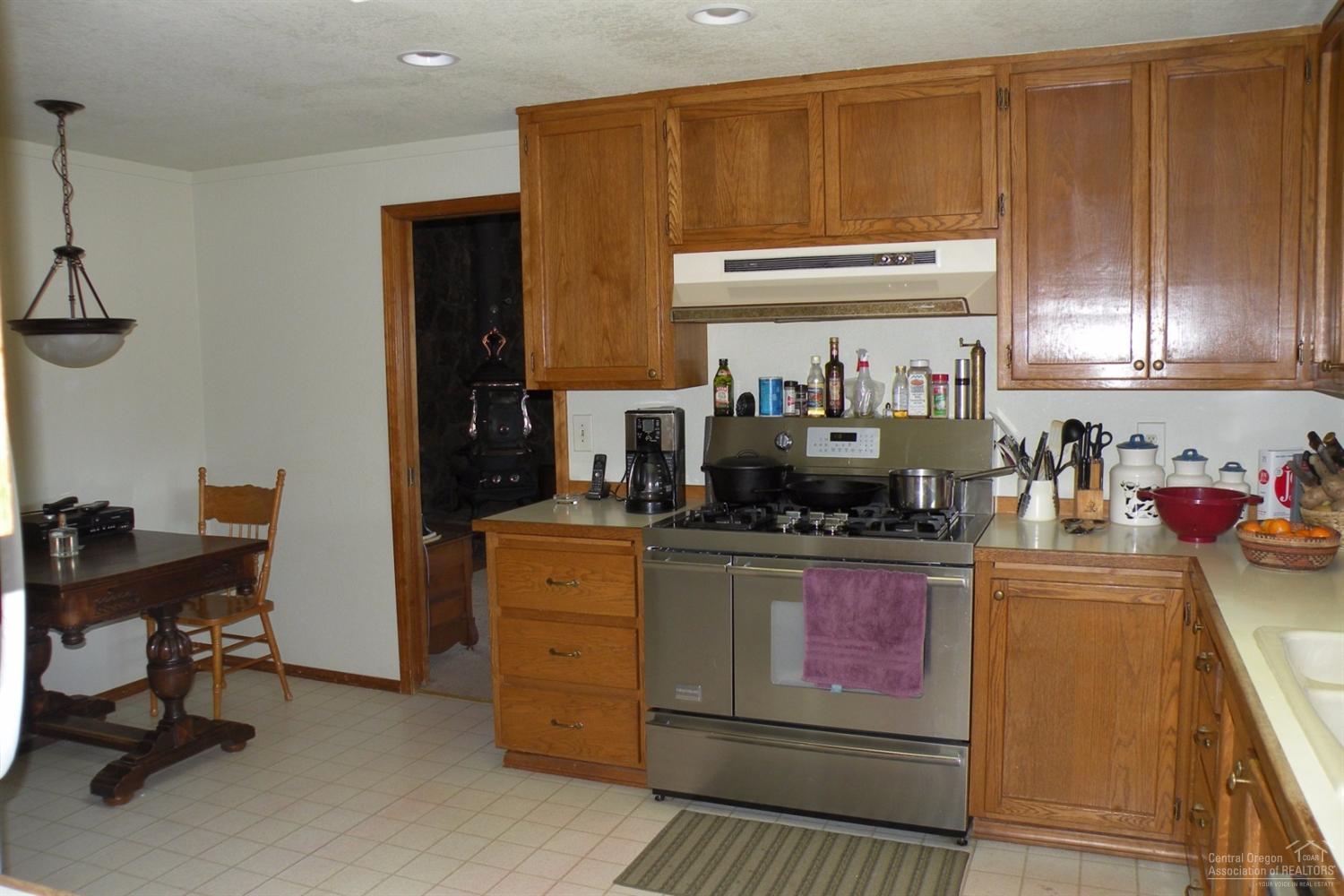 60500 Woodside Road Bend, OR 97702 - Photo 7 of 10 a kitchen with a stove and cabinets
