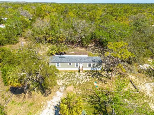 a view of a house with a big yard