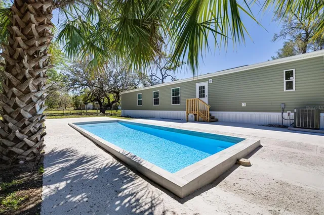 a view of outdoor space and swimming pool
