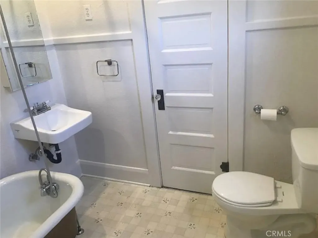 558 East 9th Street Upland, CA 91786 - Photo 8 of 10 a bathroom with a sink a toilet and shower