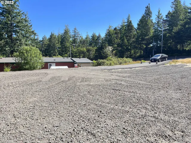a backyard of a house with large trees
