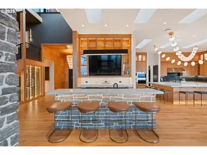 a living room with fireplace furniture and a large window