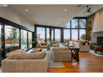 a living room with furniture and a large window